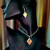 Hand carved mammoth tusk necklace and matching earrings.